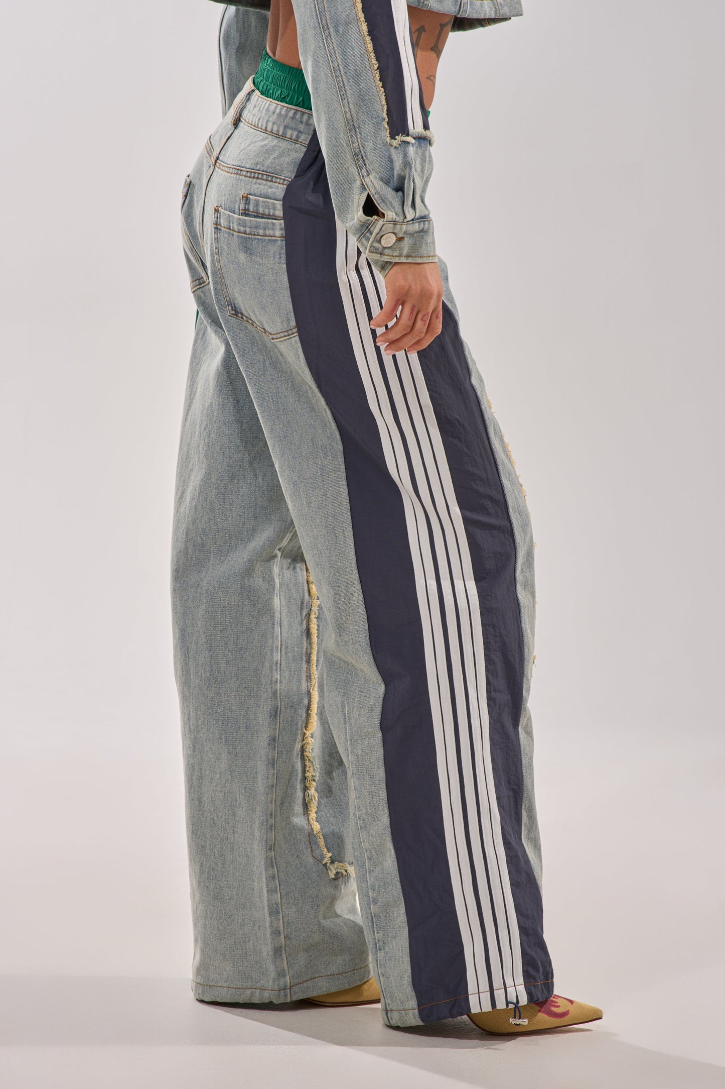 ALL AROUND THE WORLD PATCHWORK DENIM JOGGER PANT IN GREEN MULTI